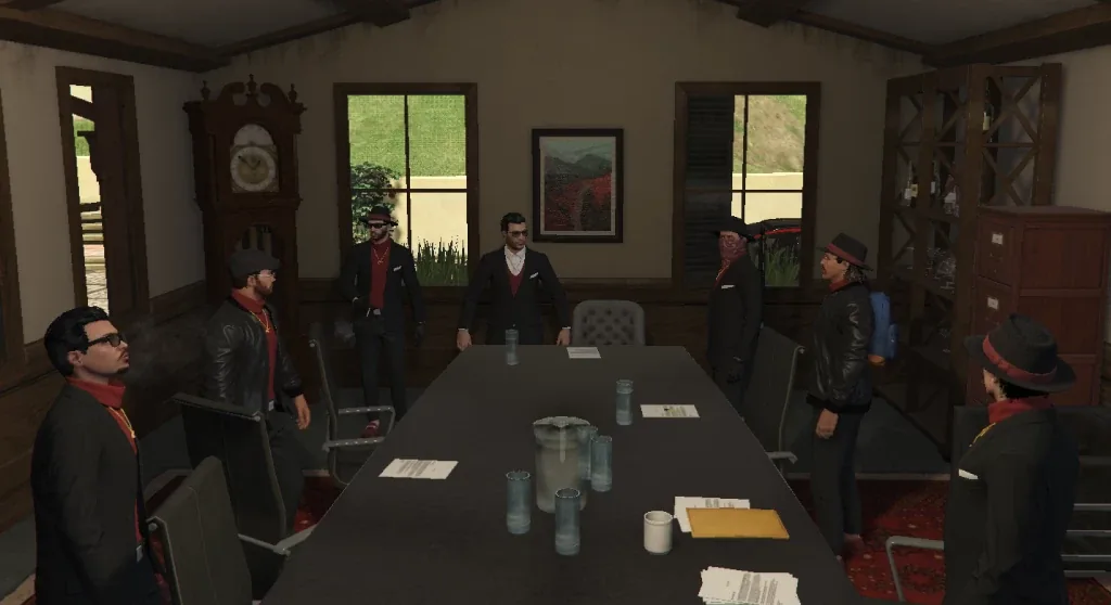 Des hommes en costume debout autour d'une table de réunion