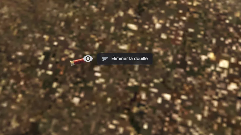 Une douille au sol en jeu, avec la cible « Éliminer la douille »